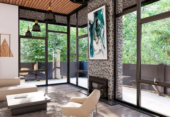 Bild Große Aluminiumfenster mit individuellem Design bieten einen weiten Blick auf die grüne Umgebung eines modernen Wohnzimmers.