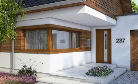 Bild Weißes Haus mit Eckfenster und Eingangs Türen aus Kunststoff in Golden Oak Dekorfolie
