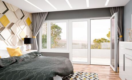 Bild Großer bunter Schlafzimmer mit Doppelbett und  weißen Balkontür und Fenster in Iglo 5 Classic Kunststoff Systeme