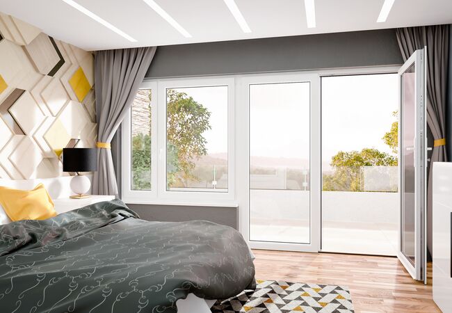 Bild Großer bunter Schlafzimmer mit Doppelbett und  weißen Balkontür und Fenster in Iglo 5 Classic Kunststoff Systeme